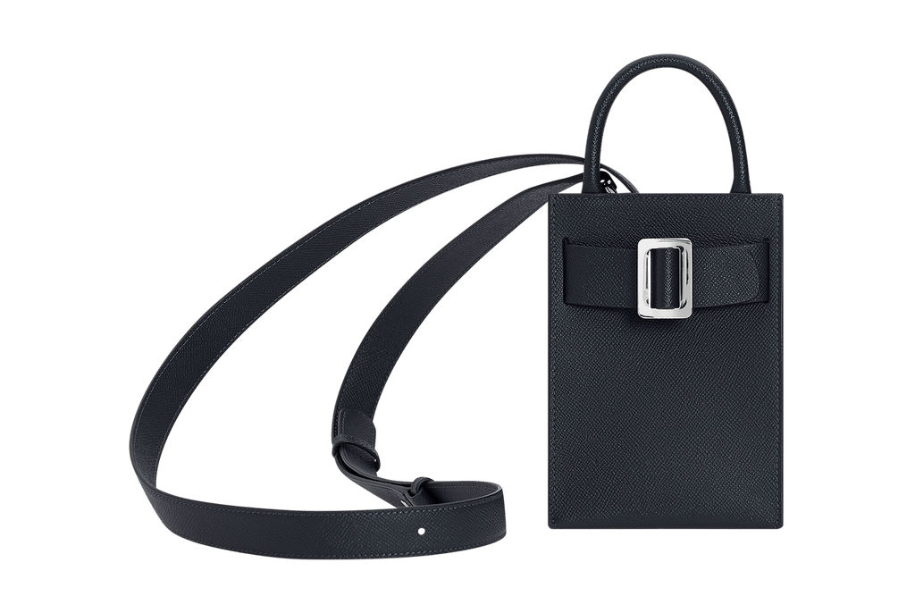 Elongated, small structured blue handbag with a silver buckle on the front, carry strap, and twin handles. Made with grained calfskin leather.