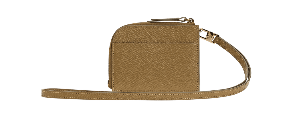 Rectangular cardholder in grained brown leather with oversized gold buckle and leather belt, zip closure, and leather carrying strap.