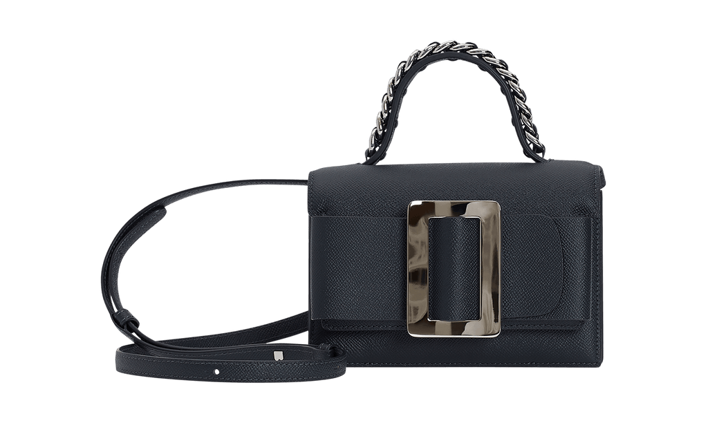 Small blue leather handbag. Features a single carry handle with chain detail, a carry strap, a large silver buckle and front flap closure.