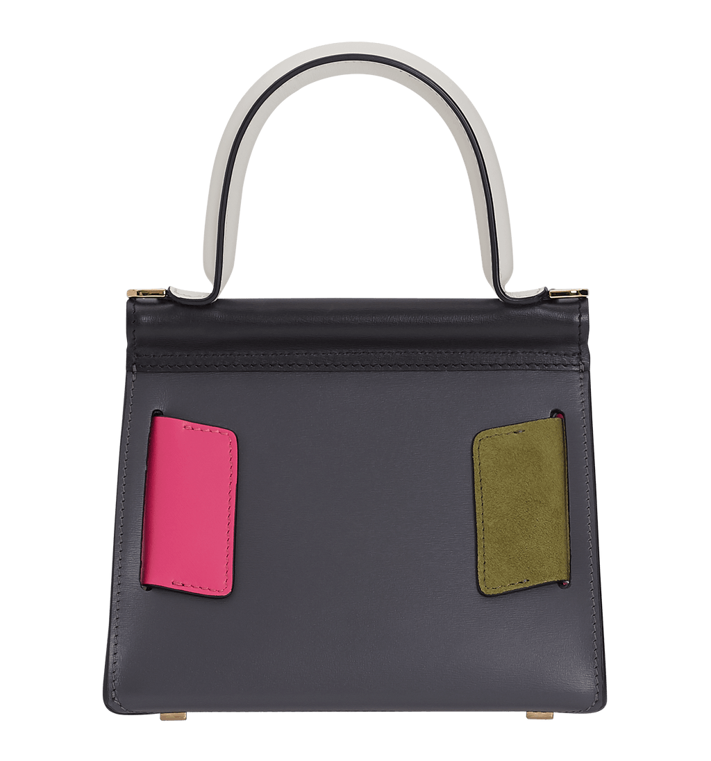 Smooth leather, structured handbag with an oversized leather buckle, single carry handle, carry strap, and front flap closure.