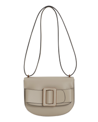 Tortora beige BOYY SADDLE bag made of palmellato calfskin leather, with a structured saddle-shaped silhouette, flap closure, adjustable shoulder-to-crossbody strap, and signature oversized buckle