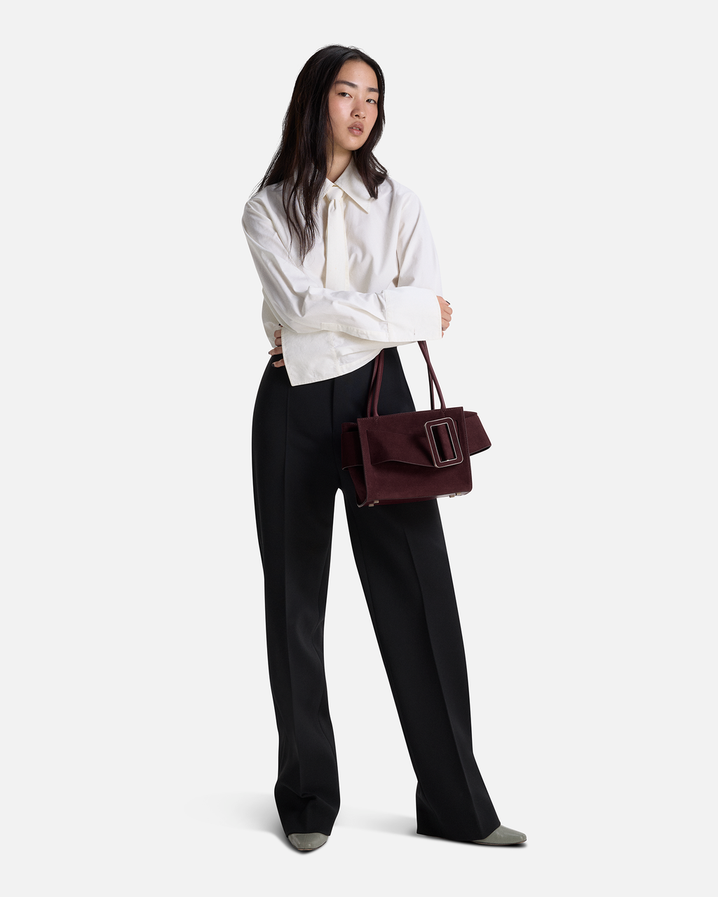 Red Plum BOYY BOBBY soft 23 luxury handbag made of suede calfskin leather with fine-grain calfskin lining. Features a relaxed, modern silhouette, extended over the shoulder handles with an oversized belt, buckle, and zipper closure on model