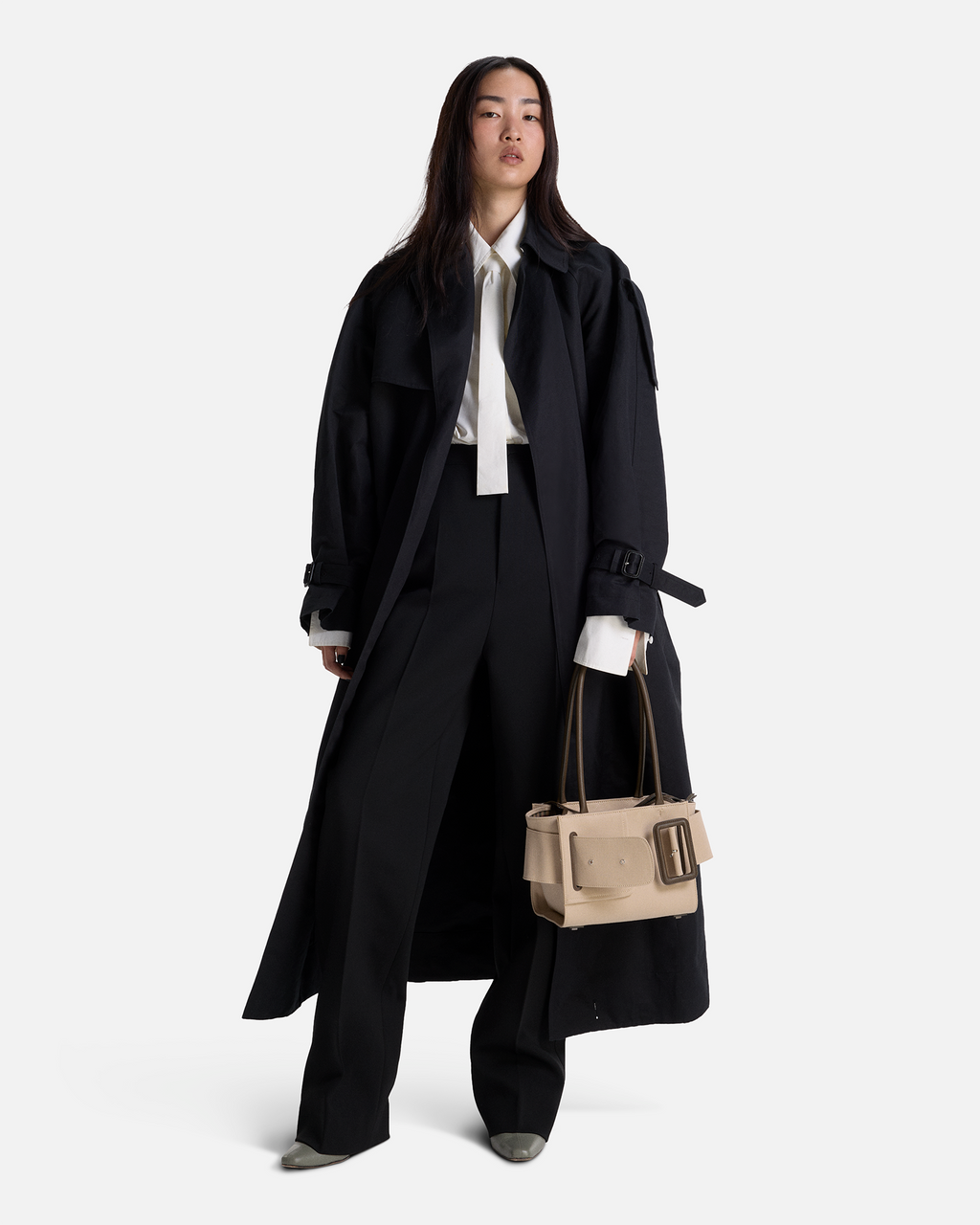 Beige BOYY BOBBY soft 23 luxury handbag made of cotton, polyurethane and calfskin leather. Features a relaxed, modern silhouette, extended over the shoulder handles with an oversized belt, buckle, and zipper closure on model