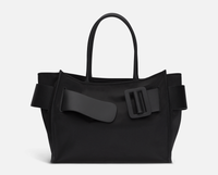 Black BOYY BOBBY soft luxury handbag made of econyl nylon with calfskin leather. Features a relaxed, modern silhouette with an oversized belt, buckle, and zipper closure