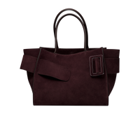 Red Plum BOYY BOBBY soft luxury handbag made of suede calfskin leather with fine-grain calfskin lining. Features a relaxed, modern silhouette, extended over the shoulder handles with an oversized belt, buckle, and zipper closure