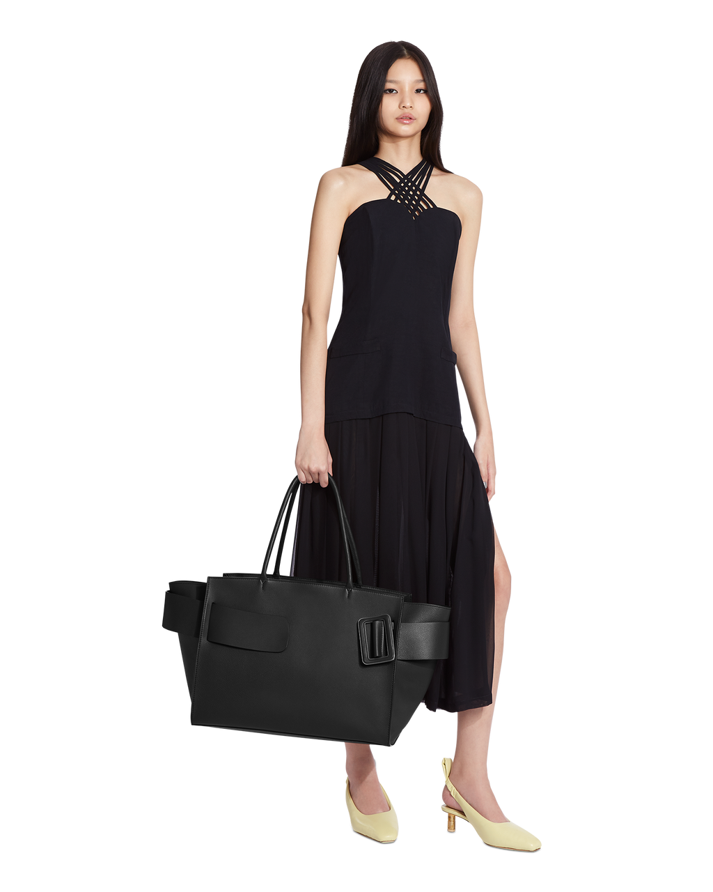 Black BOYY BOBBY Weekend soft luxury handbag made of calfskin leather with fine-grain calfskin lining. Features a relaxed, modern silhouette, extended over the shoulder handles with an oversized belt, buckle, and zipper closure on model