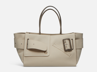 Beige BOYY BOBBY Weekend Soft luxury handbag made of cotton, polyurethane and calfskin leather. Features a relaxed, modern silhouette, extended over the shoulder handles with an oversized belt, buckle, and zipper closure