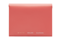 Coral red box calf leather passport case with grey goat skin lining, four internal slots, and a seamless single-piece design. The text “BOYY MILANO BANGKOK” is embossed in gold and silver on the front