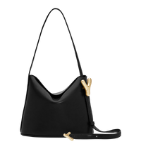 Black BOYY YY SAC made of supple calfskin leather with matte finish, slouchy hobo silhouette, featuring a flap closure with signature brass Y hardware and an adjustable shoulder-to-crossbody strap