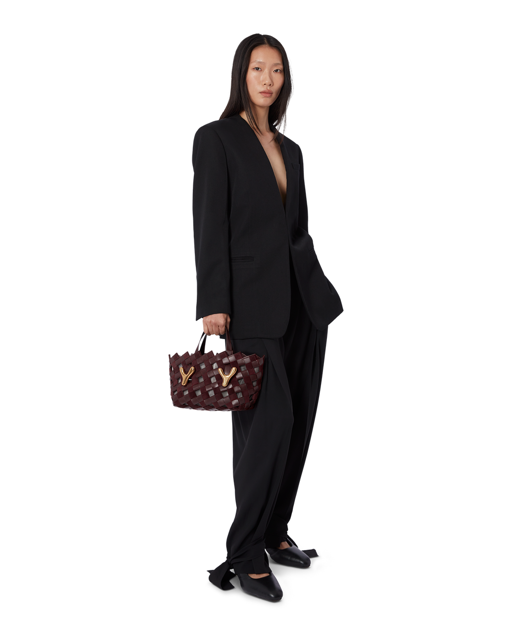 Bordeaux gaucho burgundy BOYY YY West 23 woven tote made of woven calfskin leather, with a rectangular silhouette, featuring signature brass Y hardware on both sides and adjustable shoulder handles on model