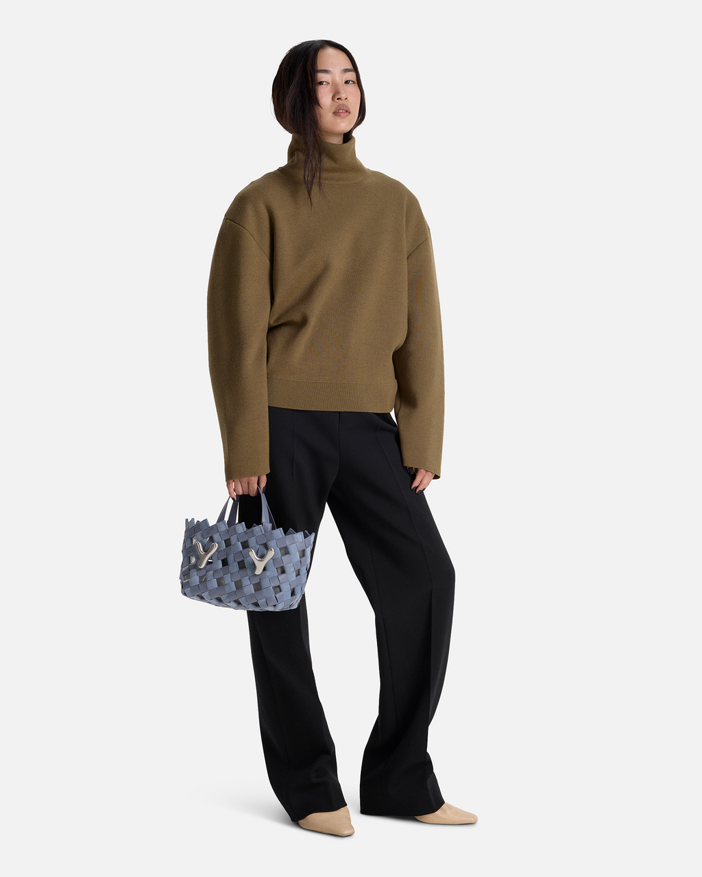 Muted Blue BOYY YY West 23 woven tote made of woven calfskin leather, with a rectangular silhouette, featuring signature brass Y hardware on both sides and adjustable shoulder handles on model
