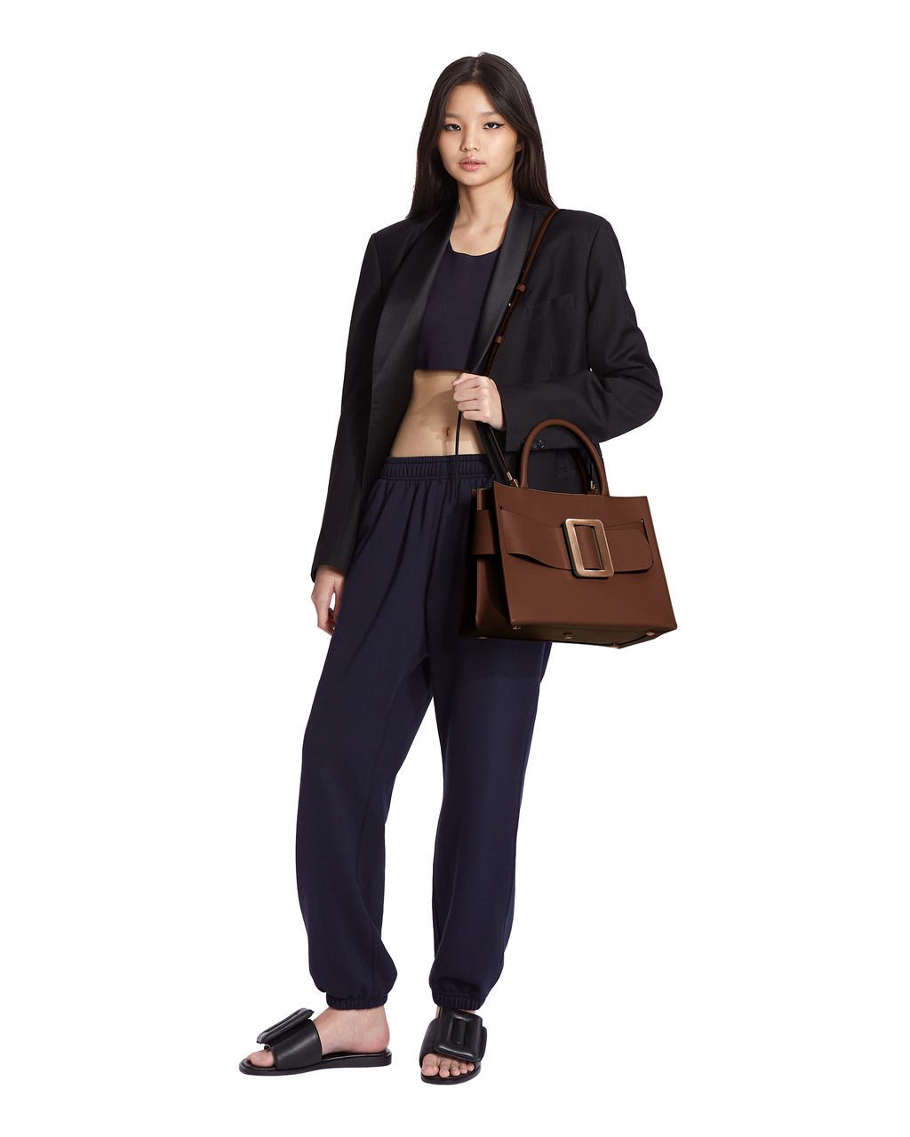 Cuoio Brown BOYY BOBBY 32 Power Bag handbag crafted from palmellato calfskin leather with suede lining. Features a structured silhouette, detachable shoulder strap, and an oversized belt and buckle closure on model