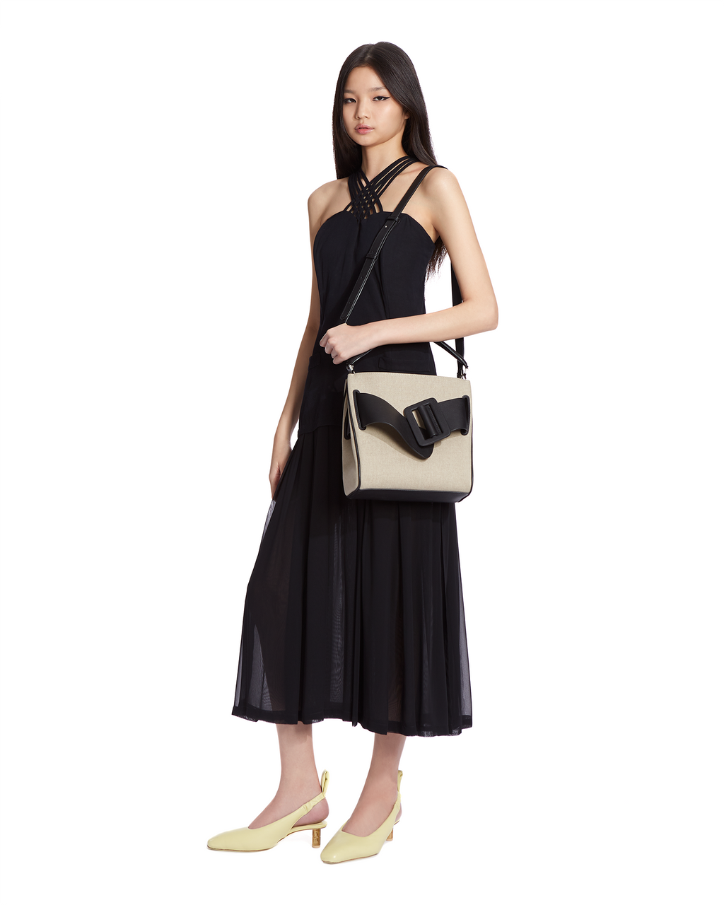 Natural black BOYY DEVON 23 soft bag made of canvas. Structured boxy silhouette with signature oversized belt with buckle. Detachable top handle and shoulder strap on model