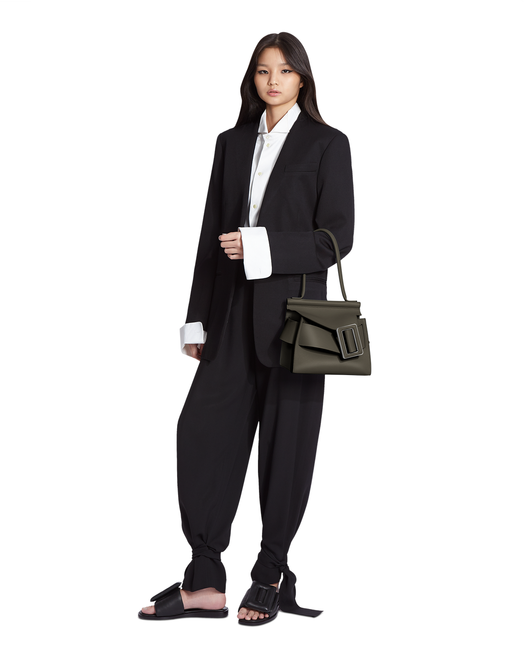Hojicha green BOYY KARL SOFT 24 luxury handbag made of fine-grain calfskin leather with suede lining. Features a relaxed, extended top handle modern silhouette, with an oversized belt, buckle, and flap closure on model