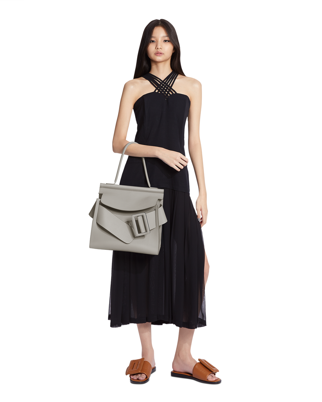 Gres beige BOYY KARL SOFT luxury handbag made of fine-grain calfskin leather with suede lining. Features a relaxed, top handle modern silhouette, with an oversized belt, buckle, and flap closure on model