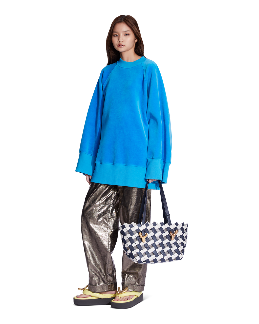 Birch marine blue BOYY YY West 26 woven tote made of woven calfskin leather, with a rectangular silhouette, featuring signature brass Y hardware on both sides and adjustable shoulder handles on model